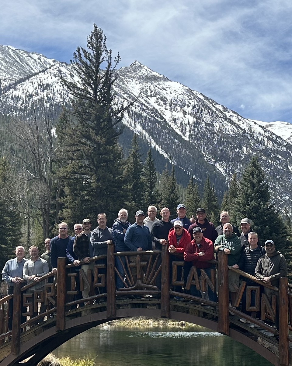 A group of Lead Bulletproof men on the Spring Canyon bridge in the Colorado Rockies during last year's Retreat.